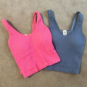 Selling two matching tank tops. One blue, one pink. Bought at Altar’d State.